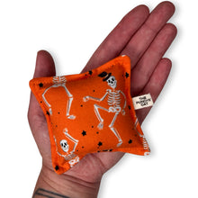 Load image into Gallery viewer, The Punchy Pillow - Skeletons on Orange