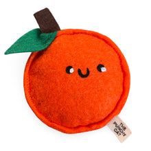 Load image into Gallery viewer, A handmade orange cat toy with a smiling face and a green leaf detail on top, made from wool felt and organic cotton filling, with a tag showing the brand name 'The Punchy Cat'.